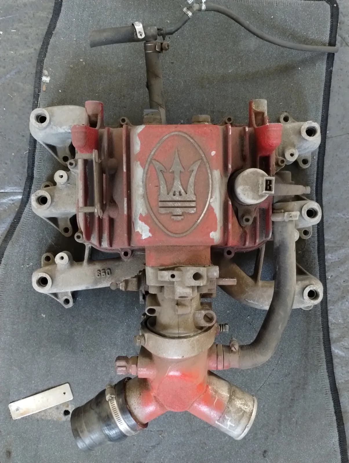 Genuine Maserati Biturbo THROTTLE BODY COVER, INTAKE MANIFOLD, THROTTLE BODY. Part number 312020027, 312220368.